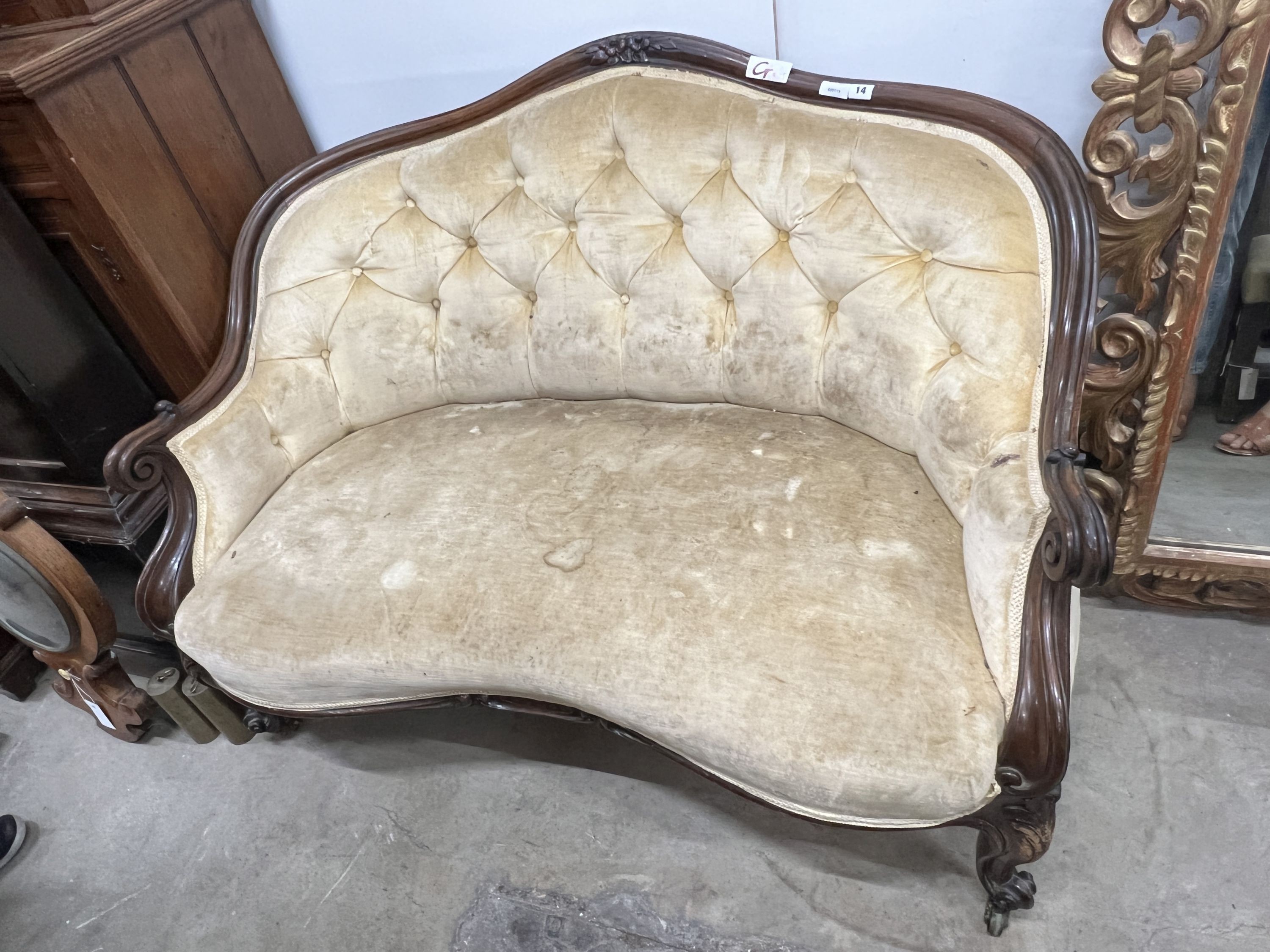 A Victorian rosewood buttonback upholstered settee, length 120cm, depth 80cm, height 84cm